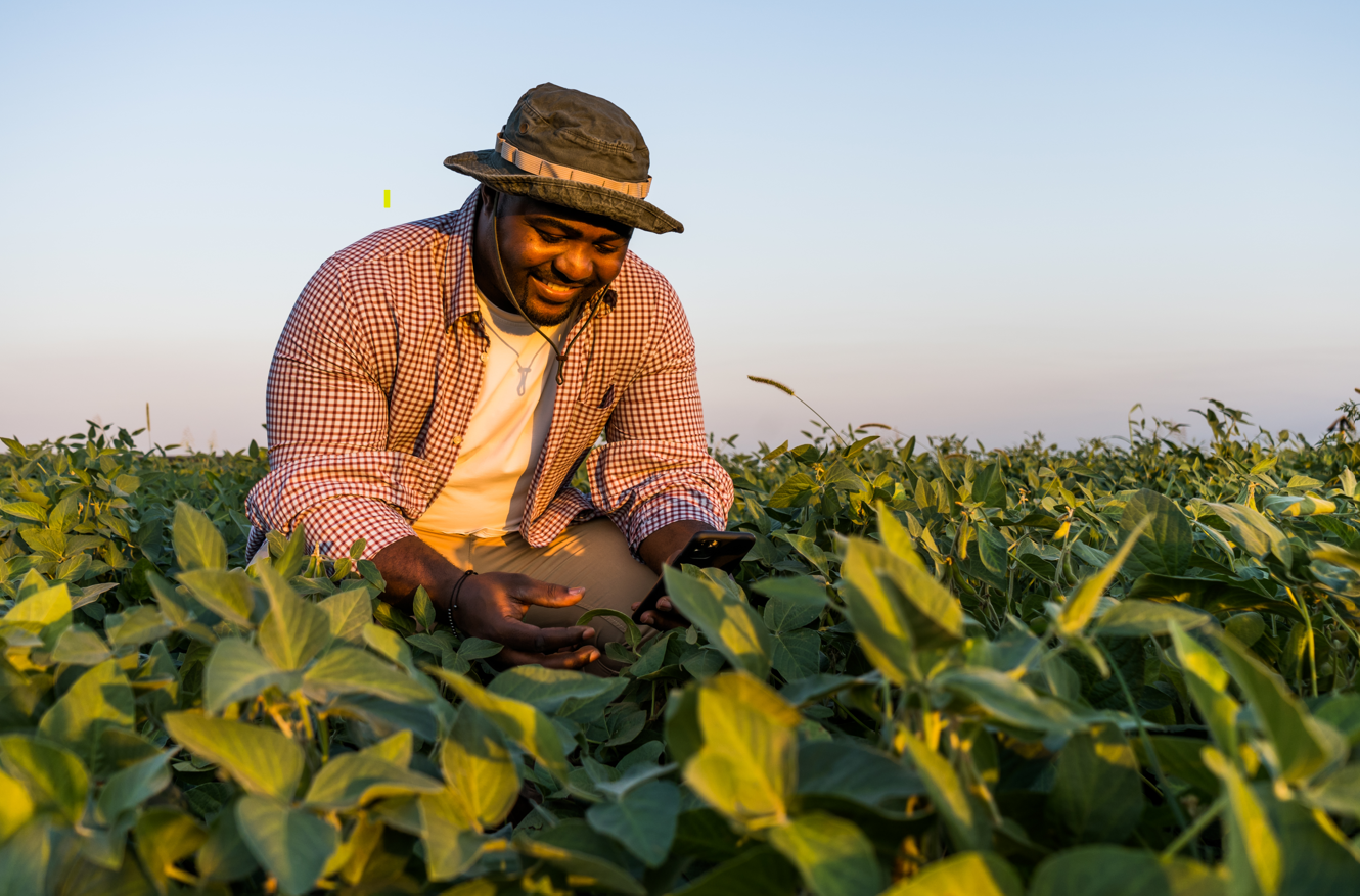 An African farmer proudly tending to their crops
